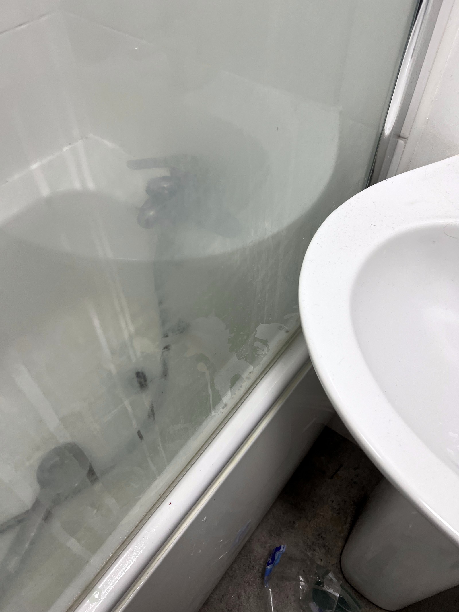 Shower screen before — cloudy and stained