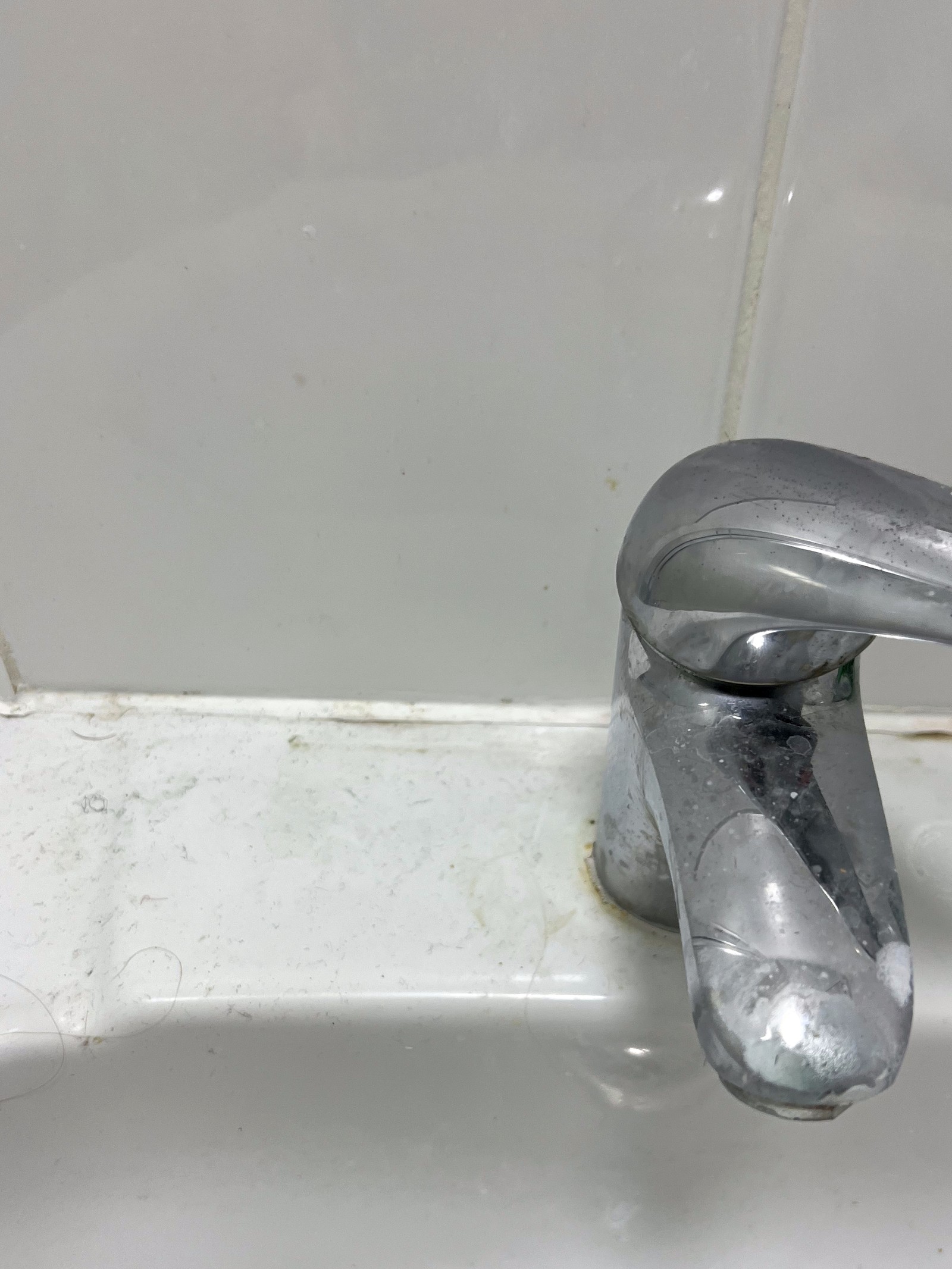 Tap before — limescale and water marks